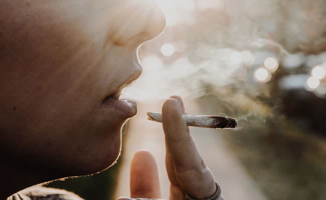 Teenage child smoking pot